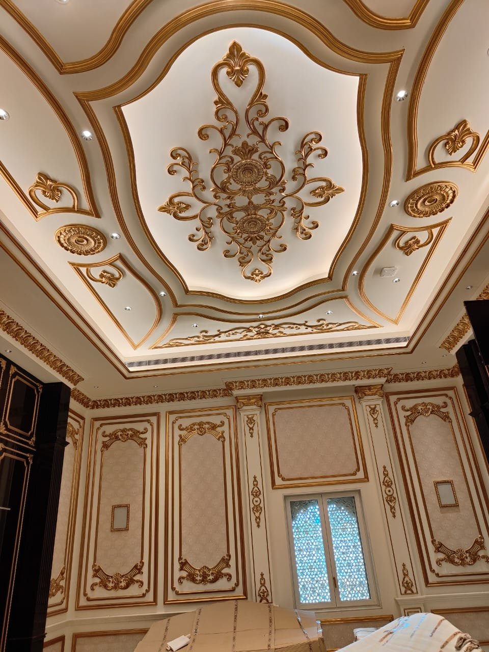 Artisan applying gold leafing